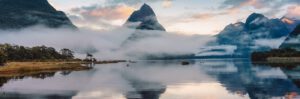 Mitre peak and foggy on the lake at Fjordland