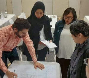 aquaculture consulting group of men and women planning fish farming set up